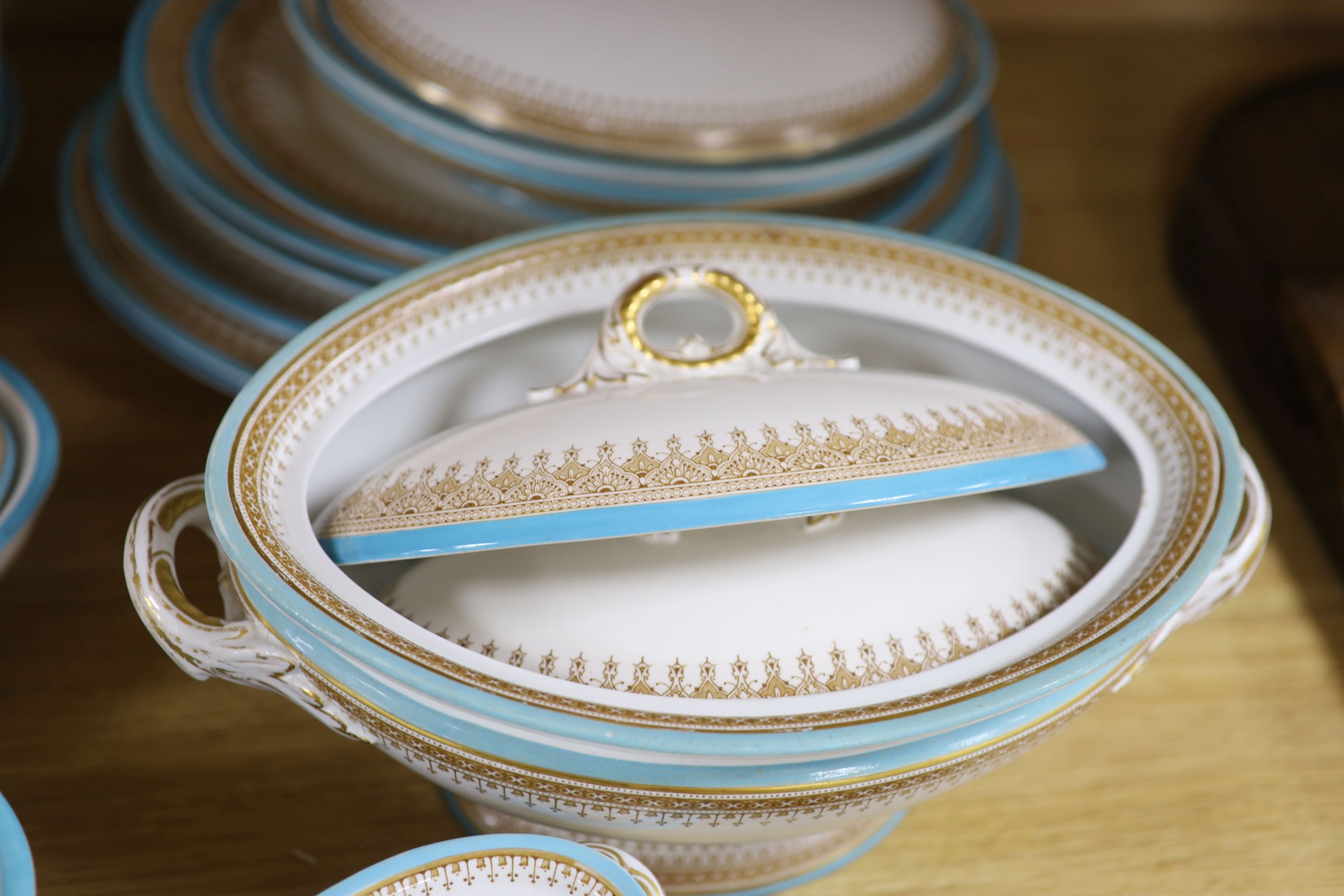 A Royal Worcester Vitreous pattern pale blue and gilt edged part dinner service including vegetable tureens